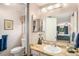 Bathroom with marble vanity and updated fixtures at 3317 S Elkhart St, Aurora, CO 80014