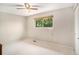 Simple bedroom with ceiling fan and neutral wall colors at 3317 S Elkhart St, Aurora, CO 80014
