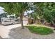 Two-story house with a large tree in front and RV parking at 3317 S Elkhart St, Aurora, CO 80014