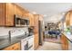 Kitchen boasts stainless steel appliances and ample cabinetry at 3317 S Elkhart St, Aurora, CO 80014