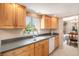 Well-lit kitchen with light wood cabinets and granite countertops at 3317 S Elkhart St, Aurora, CO 80014