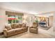 Living room with view of kitchen and backyard access at 3317 S Elkhart St, Aurora, CO 80014