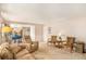 Living room with additional seating and view of kitchen at 3317 S Elkhart St, Aurora, CO 80014