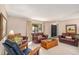 Spacious living room featuring leather sofas and a wood coffee table at 3317 S Elkhart St, Aurora, CO 80014