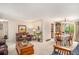 Bright living room with dining area, featuring hardwood floors and neutral colors at 3317 S Elkhart St, Aurora, CO 80014