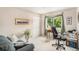 Home office with built-in desk and window overlooking the backyard at 3317 S Elkhart St, Aurora, CO 80014
