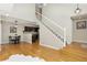 Spacious living room with hardwood floors and a staircase at 1381 W 112Th Ave # D, Denver, CO 80234