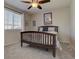 Bedroom with a ceiling fan and a window; decorated with a modern touch at 23500 Bent Oaks Way, Parker, CO 80138