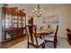 Inviting dining room showcasing a chandelier, hardwood floors, and elegant furnishings at 23500 Bent Oaks Way, Parker, CO 80138