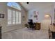 Bright home office featuring a vaulted ceiling, plantation shutters, and comfortable workspace at 23500 Bent Oaks Way, Parker, CO 80138