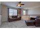 Comfortable upstairs living area with a ceiling fan and a cozy leather sofa at 23500 Bent Oaks Way, Parker, CO 80138