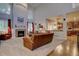 Open living room with high ceilings, fireplace, and view into the kitchen at 23500 Bent Oaks Way, Parker, CO 80138