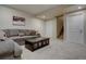 This living room features recessed lighting, a comfortable grey couch, and stairs to the upper level at 23500 Bent Oaks Way, Parker, CO 80138