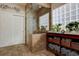 The bathroom features a glass enclosed shower with tiled surround and built-in shelving at 23500 Bent Oaks Way, Parker, CO 80138