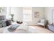 Bright bedroom featuring a cozy bed with decorative pillows, a chair, and natural light from a large window at 4363 W 118Th Way, Westminster, CO 80031