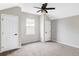 Bright bedroom featuring neutral carpet, two closets, and natural light from a double window at 4363 W 118Th Way, Westminster, CO 80031