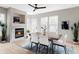 Stylish dining room with a fireplace, hardwood floors, and a view of the backyard at 4363 W 118Th Way, Westminster, CO 80031