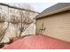 Exterior view with red deck and partially bare tree in small enclosed yard at 4363 W 118Th Way, Westminster, CO 80031