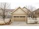 Exterior showcasing a two-car garage with a light brown door, set in a residential neighborhood at 4363 W 118Th Way, Westminster, CO 80031