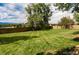 Spacious backyard with healthy green grass and mature trees at 7055 S Costilla St, Littleton, CO 80120