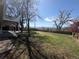 An expansive backyard with grass and mountain views beyond a wood fence at 7055 S Costilla St, Littleton, CO 80120