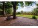 Inviting backyard patio with brickwork and shady trees at 7055 S Costilla St, Littleton, CO 80120