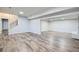 Open basement area featuring recessed lighting and laminate flooring at 7055 S Costilla St, Littleton, CO 80120