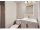 Small bathroom featuring updated vanity and toilet at 7055 S Costilla St, Littleton, CO 80120
