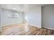 Bright bedroom with hardwood floors and a window providing natural light at 7055 S Costilla St, Littleton, CO 80120