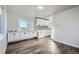Modern kitchen featuring white cabinets, sleek countertops, and stainless steel appliances at 7055 S Costilla St, Littleton, CO 80120