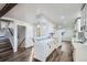 Modern kitchen featuring white cabinets, sleek countertops, and stainless-steel appliances at 7055 S Costilla St, Littleton, CO 80120