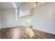 Bright living room with hardwood floors and vaulted ceiling, and large windows at 7055 S Costilla St, Littleton, CO 80120