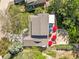 Aerial view of the home showcasing the roof, patio with umbrellas, and surrounding greenery at 6862 Independence Ct, Arvada, CO 80004