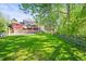 Expansive backyard featuring a basketball court and patio, perfect for outdoor entertainment and recreation at 6862 Independence Ct, Arvada, CO 80004