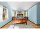 Spacious primary bedroom features hardwood floors and abundant natural light at 6862 Independence Ct, Arvada, CO 80004