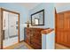 Hallway with wooden dresser and a shower room at 6862 Independence Ct, Arvada, CO 80004