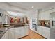 Well-equipped kitchen showcasing stainless steel appliances, granite countertops, and ample cabinet space at 6862 Independence Ct, Arvada, CO 80004