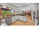 Modern kitchen featuring stainless steel appliances, granite countertops, and an open layout at 6862 Independence Ct, Arvada, CO 80004