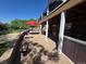 Stunning brick patio with red umbrellas and well-manicured lawn, ideal for outdoor relaxation at 6862 Independence Ct, Arvada, CO 80004