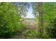 Lush landscaping with a beautiful view of the pond at 6862 Independence Ct, Arvada, CO 80004