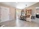 Elegant dining room with hardwood floors, a table for six, and an updated light fixture at 21225 E Aberdeen Dr, Centennial, CO 80015