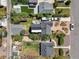 An aerial view of a home with a well-maintained yard, deck, and driveway at 1354 Tamarac St, Denver, CO 80220