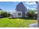 Spacious backyard with deck, seating, and green lawn at 1354 Tamarac St, Denver, CO 80220