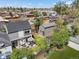 A well-maintained backyard includes a patio seating area, shed, and lush green lawn at 1354 Tamarac St, Denver, CO 80220