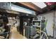 Unfinished basement with concrete floor and storage shelving at 1354 Tamarac St, Denver, CO 80220