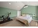 Inviting main bedroom featuring neutral carpet, a fitness bike, and an air conditioner at 1354 Tamarac St, Denver, CO 80220