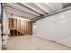 Unfinished basement featuring open ceiling with exposed pipes and studs, offering customization potential at 400 Basin Daisy St, Castle Rock, CO 80104