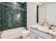 Modern bathroom with green tiled shower at 400 Basin Daisy St, Castle Rock, CO 80104
