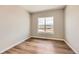 Cozy bedroom featuring wood flooring, natural light, and a serene view of the neighborhood at 400 Basin Daisy St, Castle Rock, CO 80104