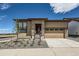 Charming single-story home featuring stone accents, a two-car garage and a well manicured front yard at 400 Basin Daisy St, Castle Rock, CO 80104